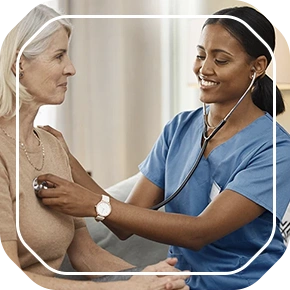 woman checking patient's heartbeat